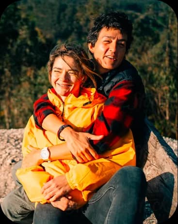 Couple embracing outdoors at sunset